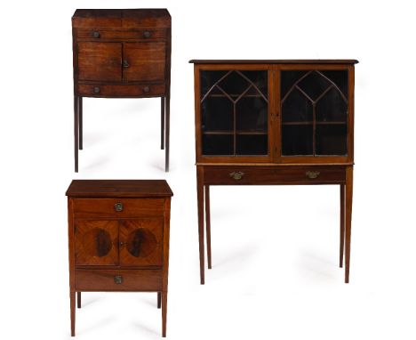 A GEORGE III MAHOGANY BOW FRONTED WASH STAND with a lifting top, two panelled doors and a single drawer raised on square tape