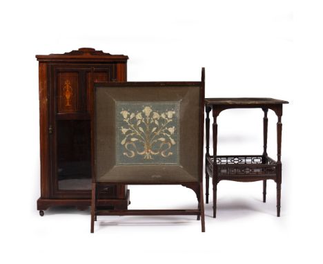 AN EDWARDIAN ROSEWOOD CABINET with a single panelled and glazed door, on a plinth base with ceramic casters, 53.5cm wide x 35