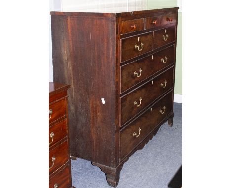 A 19TH CENTURY NORTH COUNTRY CHEST OF EIGHT DRAWERS with brass swan neck handles and raised on bracket feet, 132cm wide x 54c
