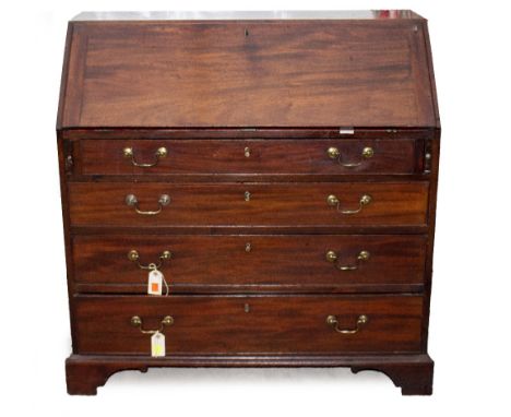 A GEORGIAN MAHOGANY BUREAU the fall front above four long graduated drawers with brass swan neck handles and raised on bracke