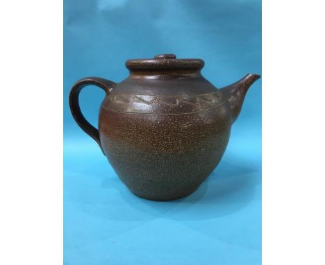 A very large earthenware pottery brown glazed teapot, 36cm height x 53cm wide