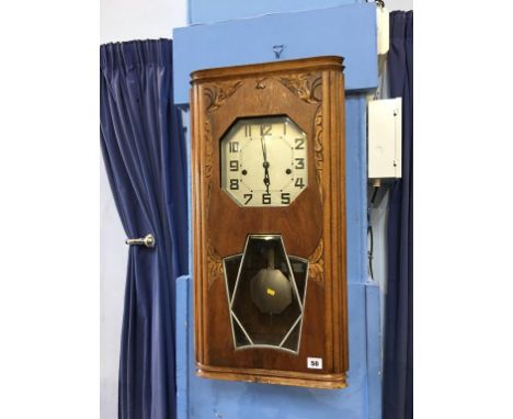 An Art Deco wall clock, with octagonal silvered dial