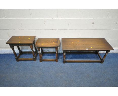 A 20TH CENTURY OAK COFFEE TABLE, raised on turned legs, united by stretchers, width 92cm x depth 38cm x 43cm, along with two 