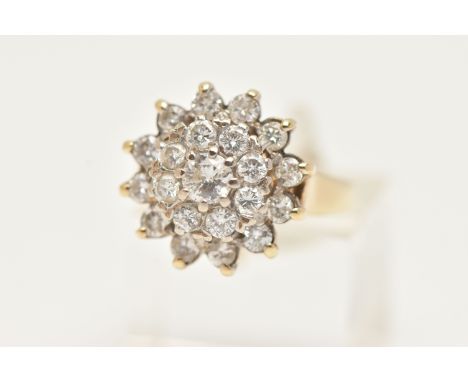 A 9CT YELLOW AND WHITE GOLD DIAMOND CLUSTER RING, the tiered diamond cluster set throughout with approximately twenty one rou