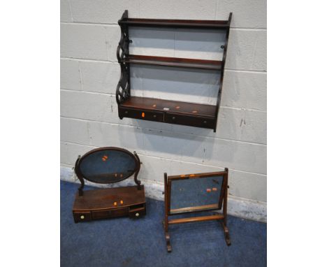 A GEORGIAN MAHOGANY SWING MIRROR, with three drawers and bone handles, along with another swing mirror, and a wall mounted wa