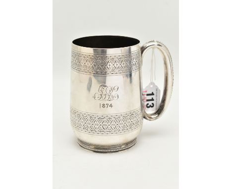 A LATE VICTORIAN SILVER TANKARD, bright cut pattern, engraved crest reads 'Fide ET Clementia', and monogram dated 1874, beade