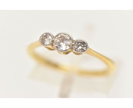 A YELLOW METAL DIAMOND THREE STONE RING, three old cut diamonds, each in a collet setting, estimated total diamond weight 0.5