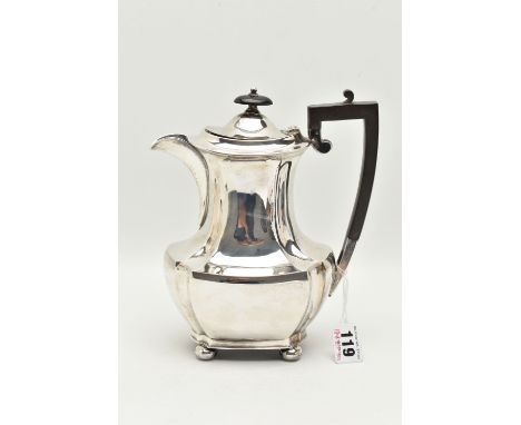 A GEORGE V SILVER COFFEE POT, faceted polished design, fitted with an ebonised handle and finial, raised on four bun feet, ha