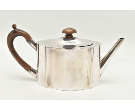 AN EDWARDIAN SILVER TEAPOT, polished wavy outline, fitted with a light wooden handle and finial, hinged cover, hallmarked 'Jo