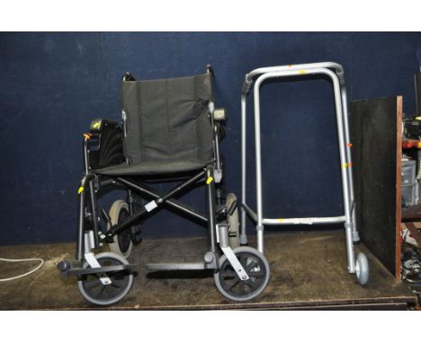 A FOLDING WHEELCHAIR WITH TWO FOOT RESTS and a walking aid (2)