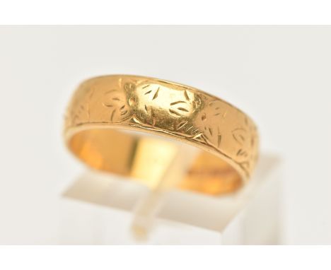 A 22CT GOLD BAND RING, a wide yellow gold band with etched floral detail, approximate width 5.5mm, hallmarked 22ct London 197