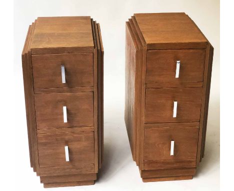 ART DECO BEDSIDE CHESTS, a pair, oak, each with three drawers, stepped top, sides and plinth base, 47cm x 34cm x 71cm H. (2)