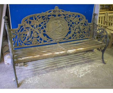 GARDEN BENCH, 19th century cast iron with female medallion centered back within scrolling foliage and birds above an iron sla