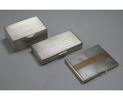 Two engine-turned white metal cigarette boxes (one marked 'S. L. Silver') and a similar gilt-banded cigarette case, 18 oz. gr