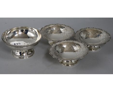 A Goldsmiths & Silversmiths Co. Ltd silver pedestal bowl with cast decoration and a set of three Mappin & Webb bowls, each wi