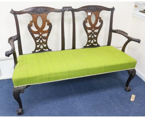 A George III Chippendale style mahogany double chair back sofa, c.1760, some later elements, W.140cm