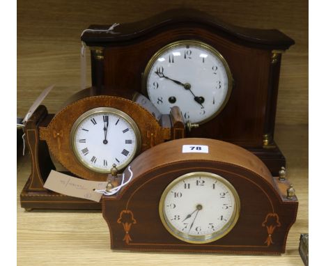 An Edwardian brass-mounted and line-inlaid mantel clock in architectural case and two smaller similar clocks