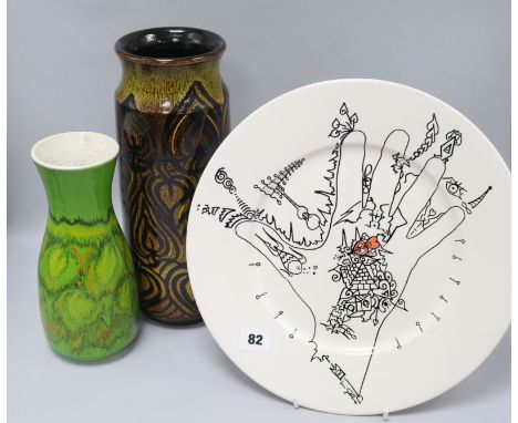 Two Poole pottery vases and a Uri Geller Poole pottery plate