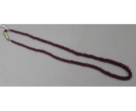 A ruby bead necklace, 22.5cm drop
