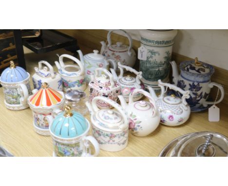 Thirteen collector's ceramic teapots, including examples by Sadler, Wedgwood, Coalport, etc., a Spanish 'Cartuja de Sevilla' 