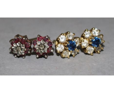 A pair of 18ct gold, sapphire and diamond cluster stud earrings and a similar pair of 9ct gold, ruby and diamond earrings fas