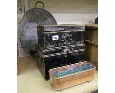 A small metal bathtub: with a copper planter and two steal boxes 