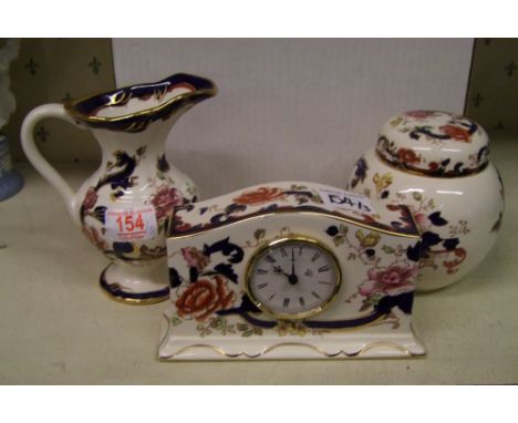 Masons blue mandalay ginger jar: together with a mantle clock and jug (3) 