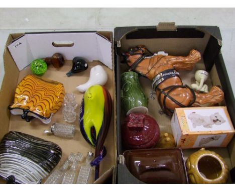 A mixed collection of ceramic and glass items: lidded face pots, glass paperweights etc (2 trays). 