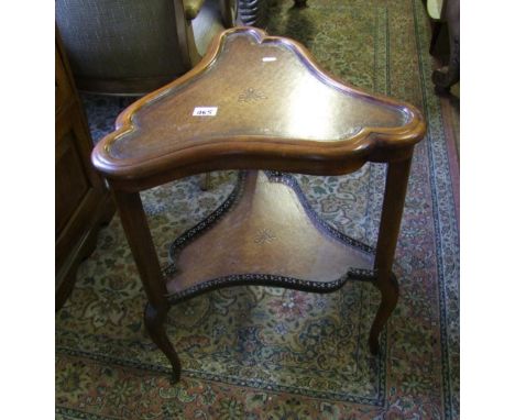 Early 20th Century two tiered table : with gallery lower tier and leather topped shelf 