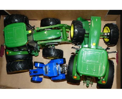 A box containing three various modern release tractor models, to include a John Deere 6930 tractor