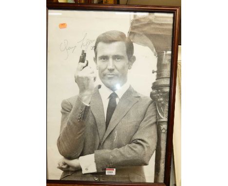A monochrome photographic promotional print of George Lazenby as 007 James Bond, 55 x 40cm 