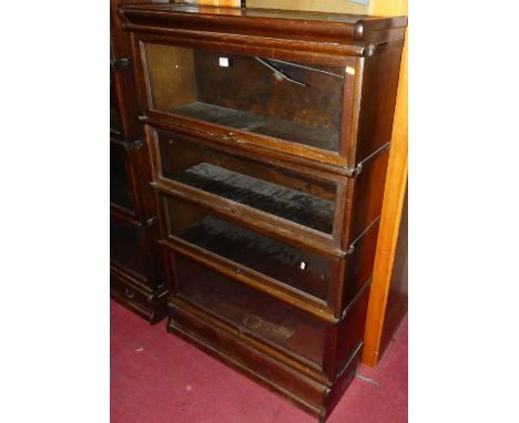 A 1920s oak Globe Wernicke four-tier stacking bookcase, having typical hinge glazed doors, width 87cmNo sign of worm. Woodwor