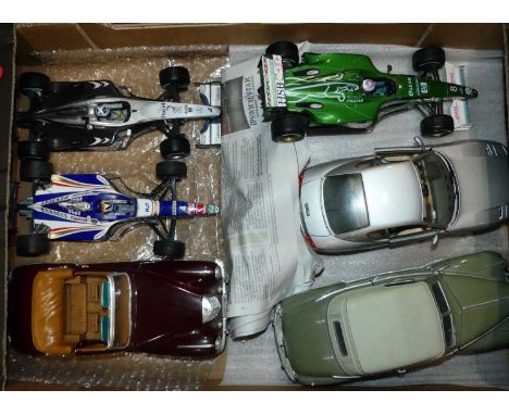 Six various loose 1:18 scale Formula 1 and Classical diecasts, to include a Hot Wheels model of a Jaguar R1 race car