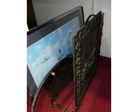 An embossed brass fire screen, a beveled oval wall mirror, one other mirror, and an aircraft print (4)