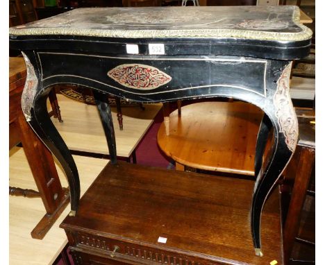 A mid-Victorian ebony and boulle card table in the French taste, the hinged top (having losses to cut brass and red tortoises