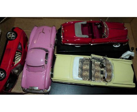 Four various boxed 1/12 and 1/18 scale loose diecast vehicles to include a 1963 Cadillac Series 62