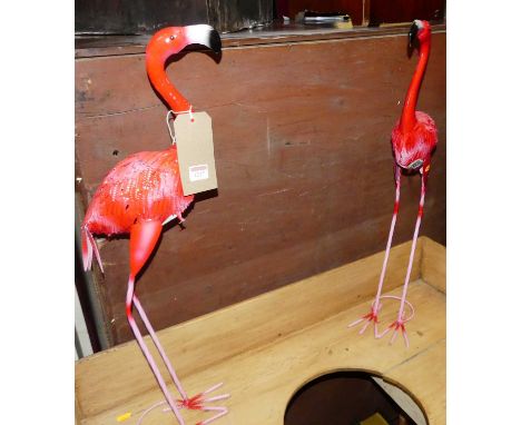 A pair of contemporary bright colour painted pressed metal model flamingoes, h.71cm