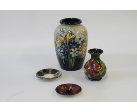 Two Moorcroft saucers, 11 and 12 cm diameter, oviform vase 23cm and a bottle vase 13cm (4) 