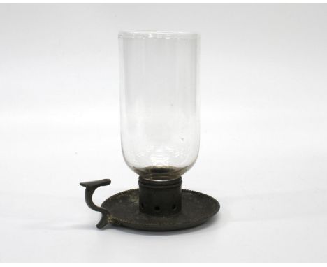 An Early 19th century Storm Lamp. Circa 1800. With a glass shade and base metal base with beaded borders.20 cm high 