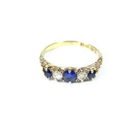 An 18 carat diamond and sapphire five stone ring, size M