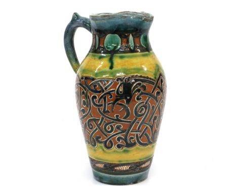 A Della Robbia Jug . By Cassandra Annie Walker. Dated 1903. The polychrome glaze with Arabesque decoration. 22cm high. 