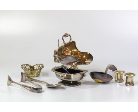 A collection of eight pieces of silver plate, including a pair of salt and peppers, a condiment spoon and a ladle