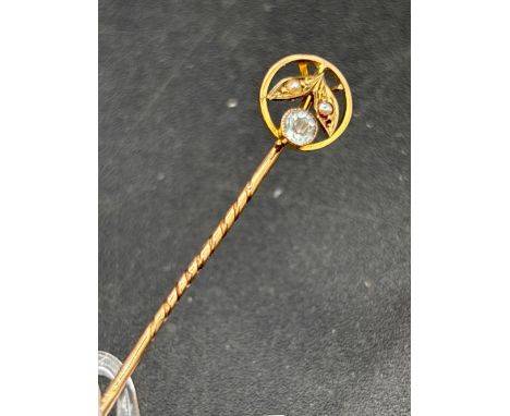 A pretty aquamarine and pearl stick pin