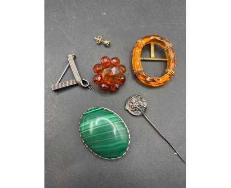 A bag of malachite brooch brooches stick pin etc.