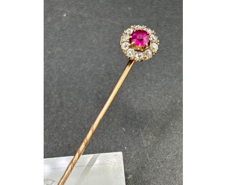 A FINE RUBY AND DIAMOND CLUSTER STICK PIN SCREW BACK