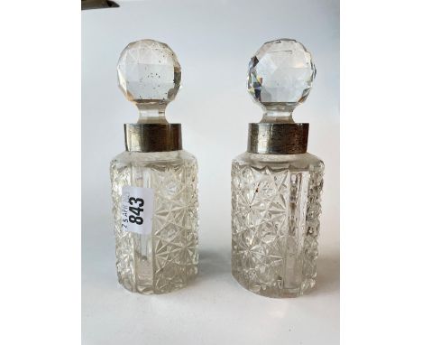 A pair of silver mounted and cut glass scent bottles with stoppers 6.5 inches high Birmingham 1898