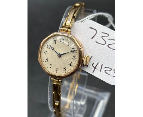 A ladies wrist watch 9ct with 9ct metal core adjustable strap by ROLEX