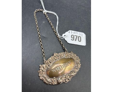 A whiskey ticket with embossed border