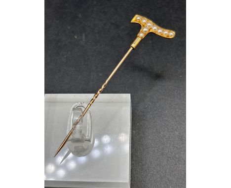 A antique pearl stick pin shaped as a walking stick 18ct gold 2.6 gms