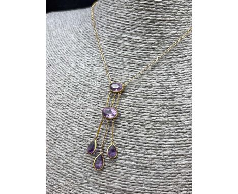 A five stone amethyst necklace set in gold 16 inch